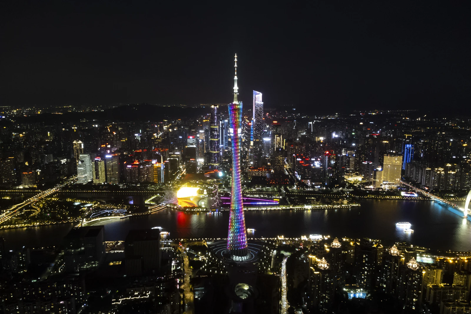 Canton Tower illuminated above the Pearl River at night