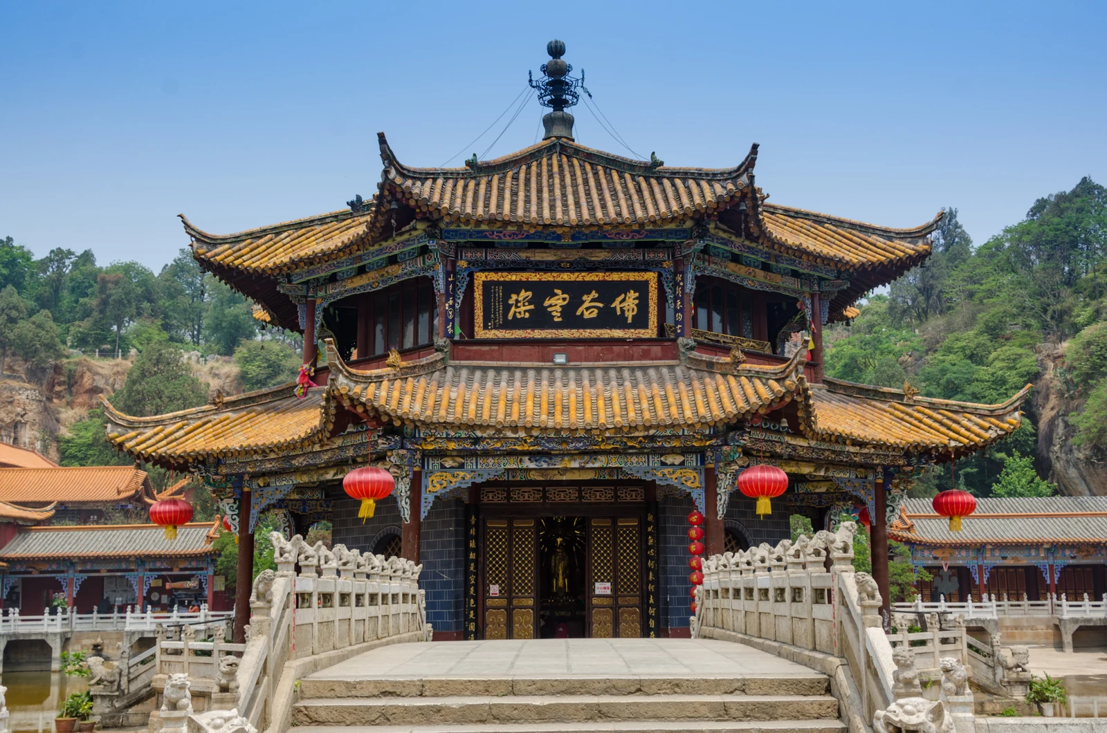 The ornate octagonal pavilion and temple roofs at Yuantong Temple in Kunming