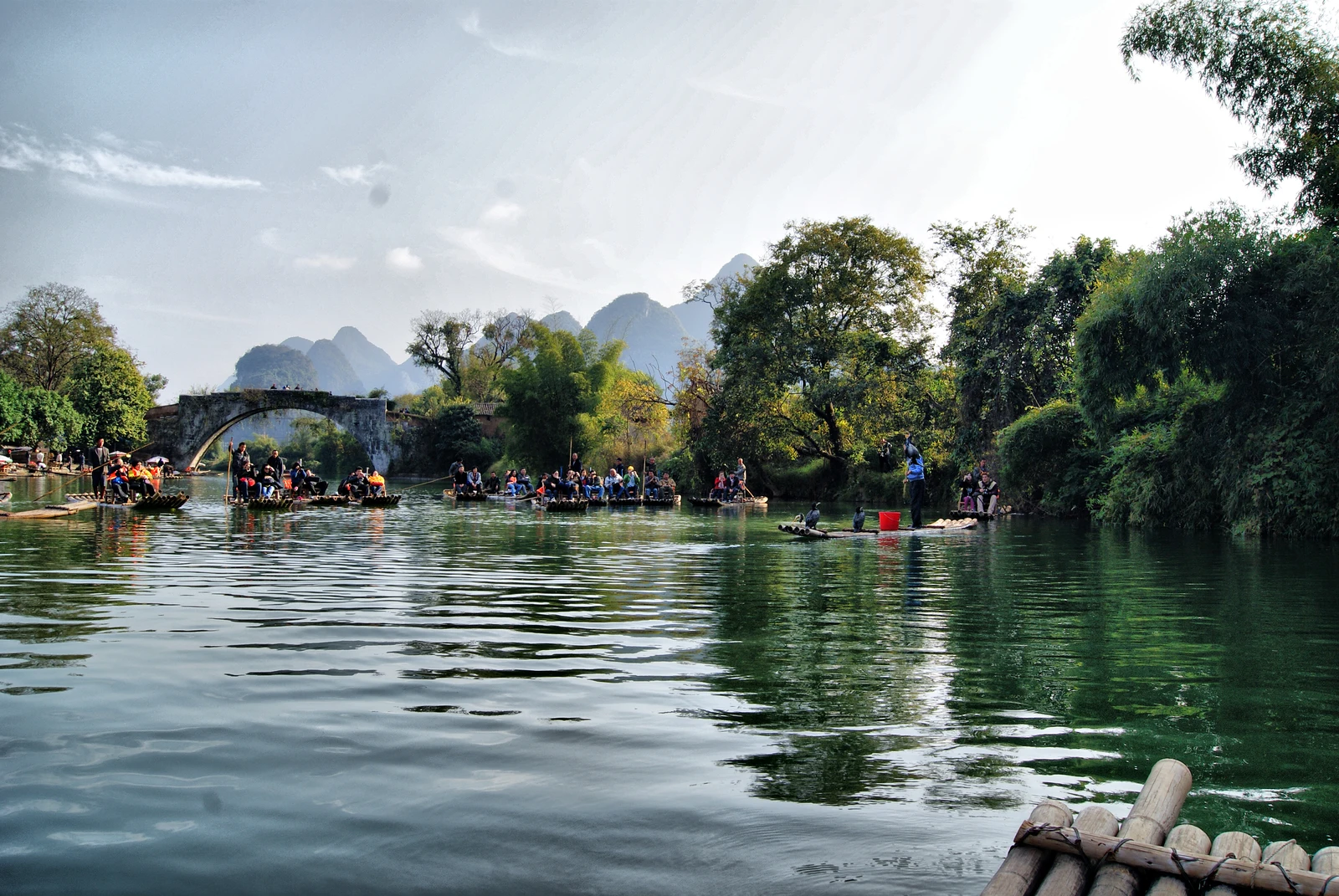 A relaxed raft trip among green karst hills on the Yulong River near Yangshuo